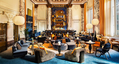 W New York – Union Square Living Room redesigned with bold modern furnishings, marble columns, and dramatic ceiling details