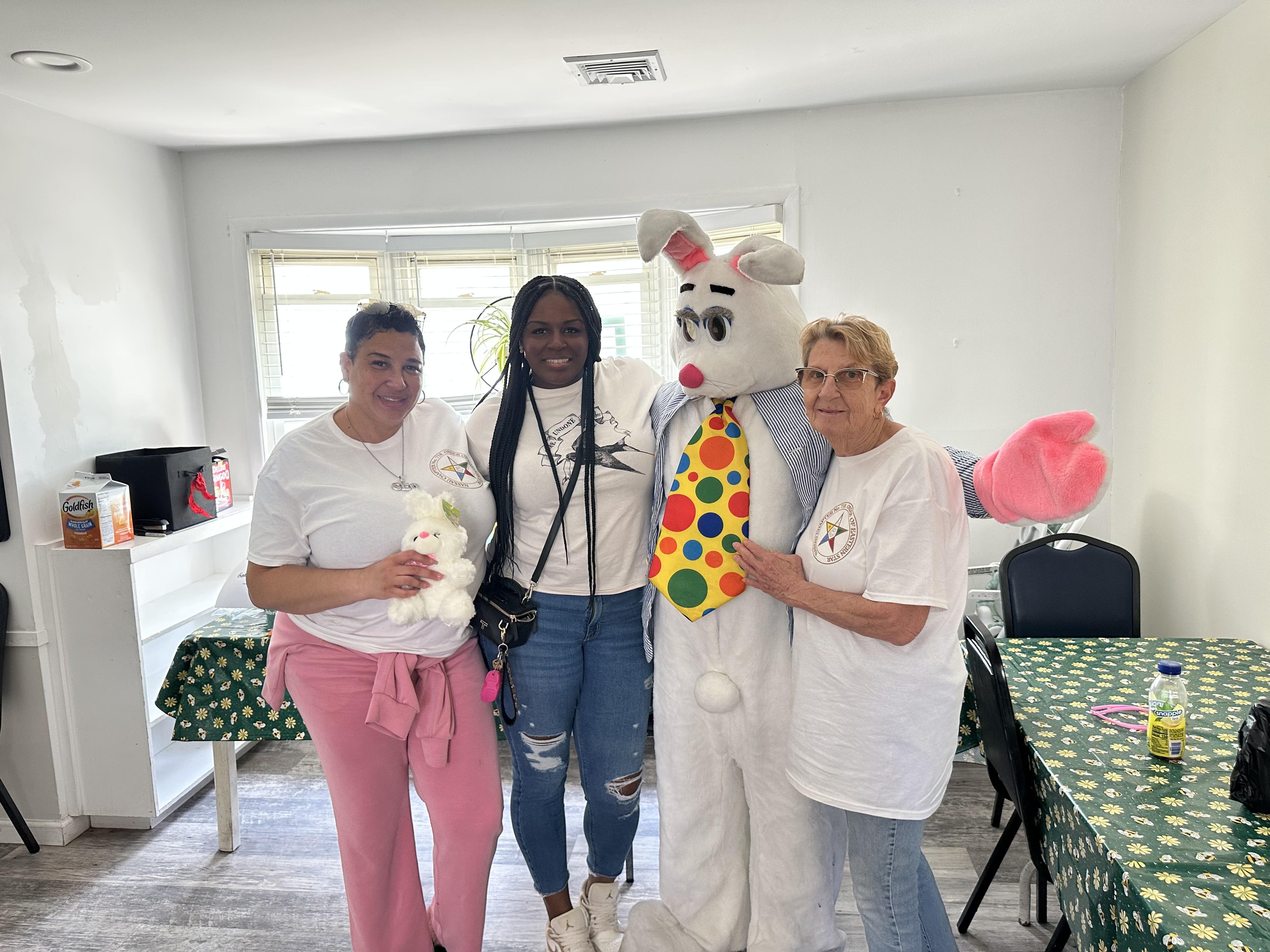 Members of Nassau Chapter 718 with Easter Bunny during community outreach event at Bethany House in Nassau County