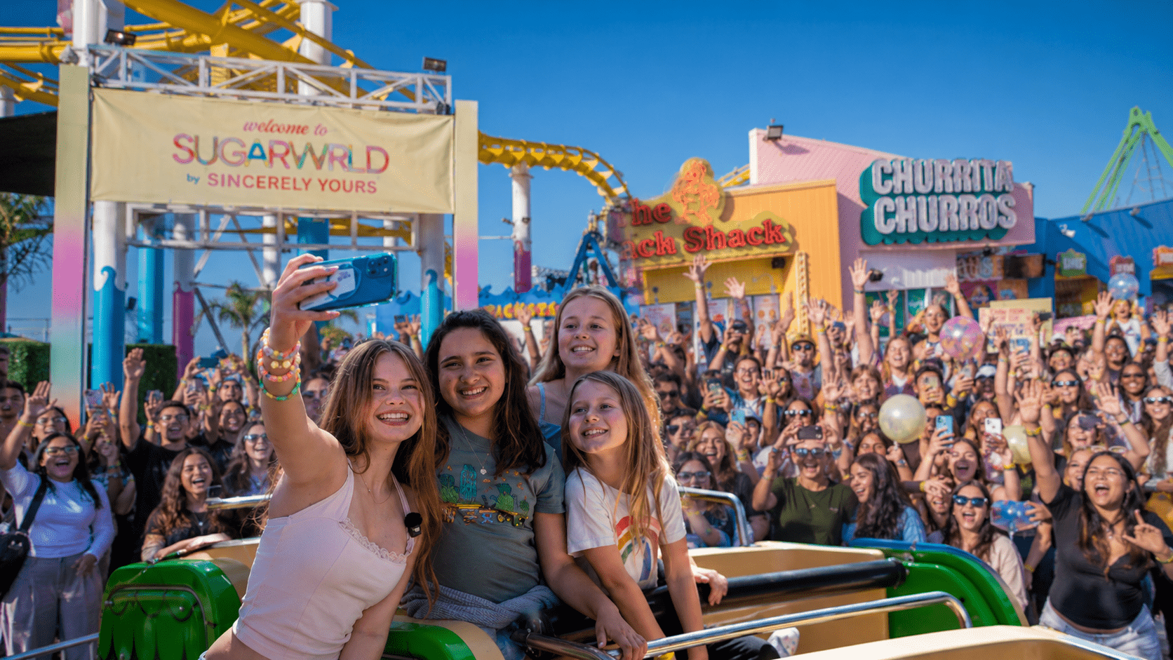 Fans celebrating at the Sincerely Yours SUGARWRLD event at Santa Monica Pier