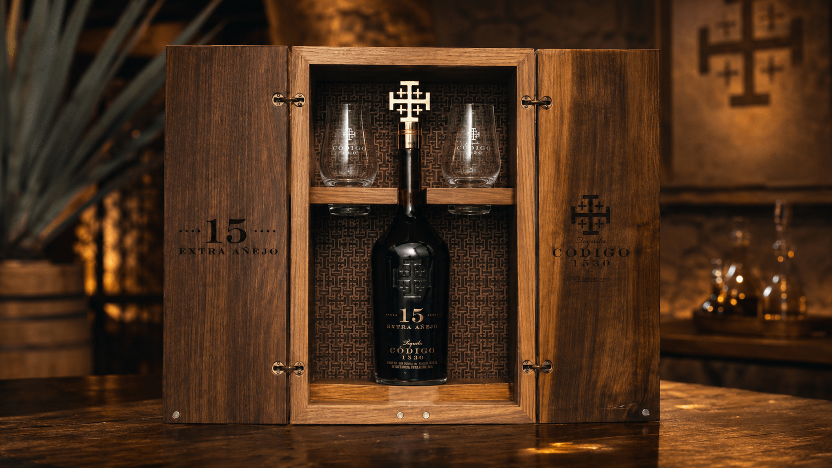Código 1530 15-Year Extra Añejo tequila in a luxury wooden presentation case with glasses and decanter