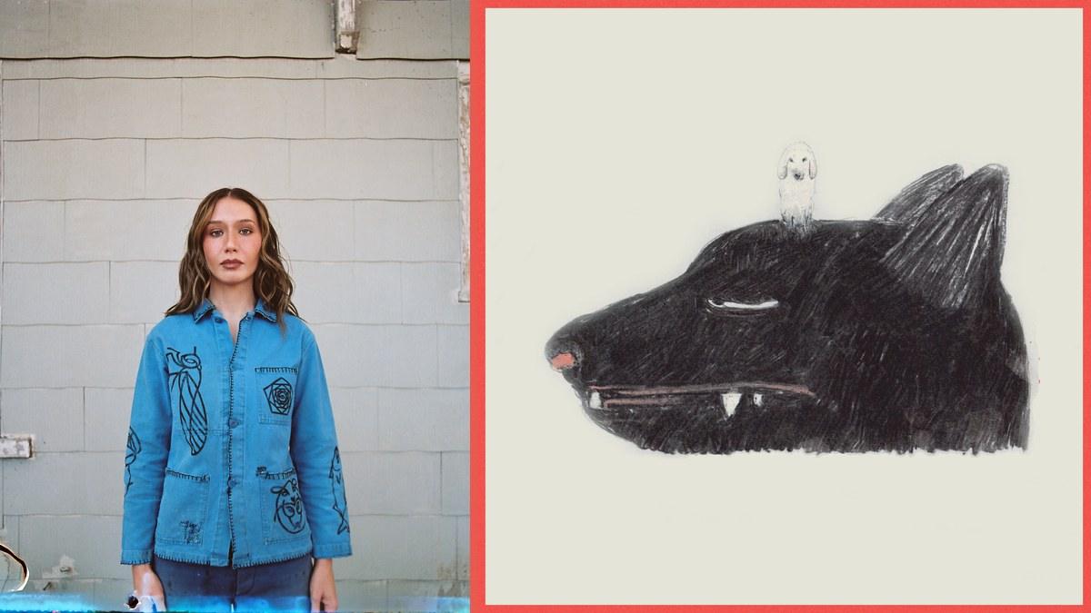 Ken Pomeroy in a hand-painted blue chore jacket beside album cover illustrated cover art of a black wolf with a small white sheep on its head